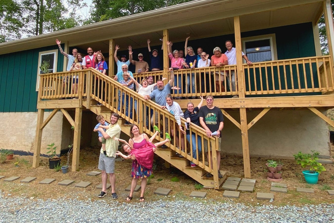 App Builds a home volunteers in front of the Gay family home. 