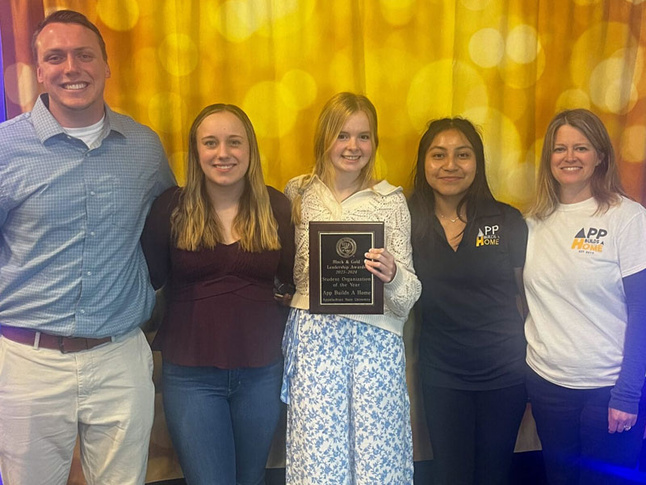 App Builds a Home Leadership Team accepting Student Organization of the Year award, along with Misty Mayfield.